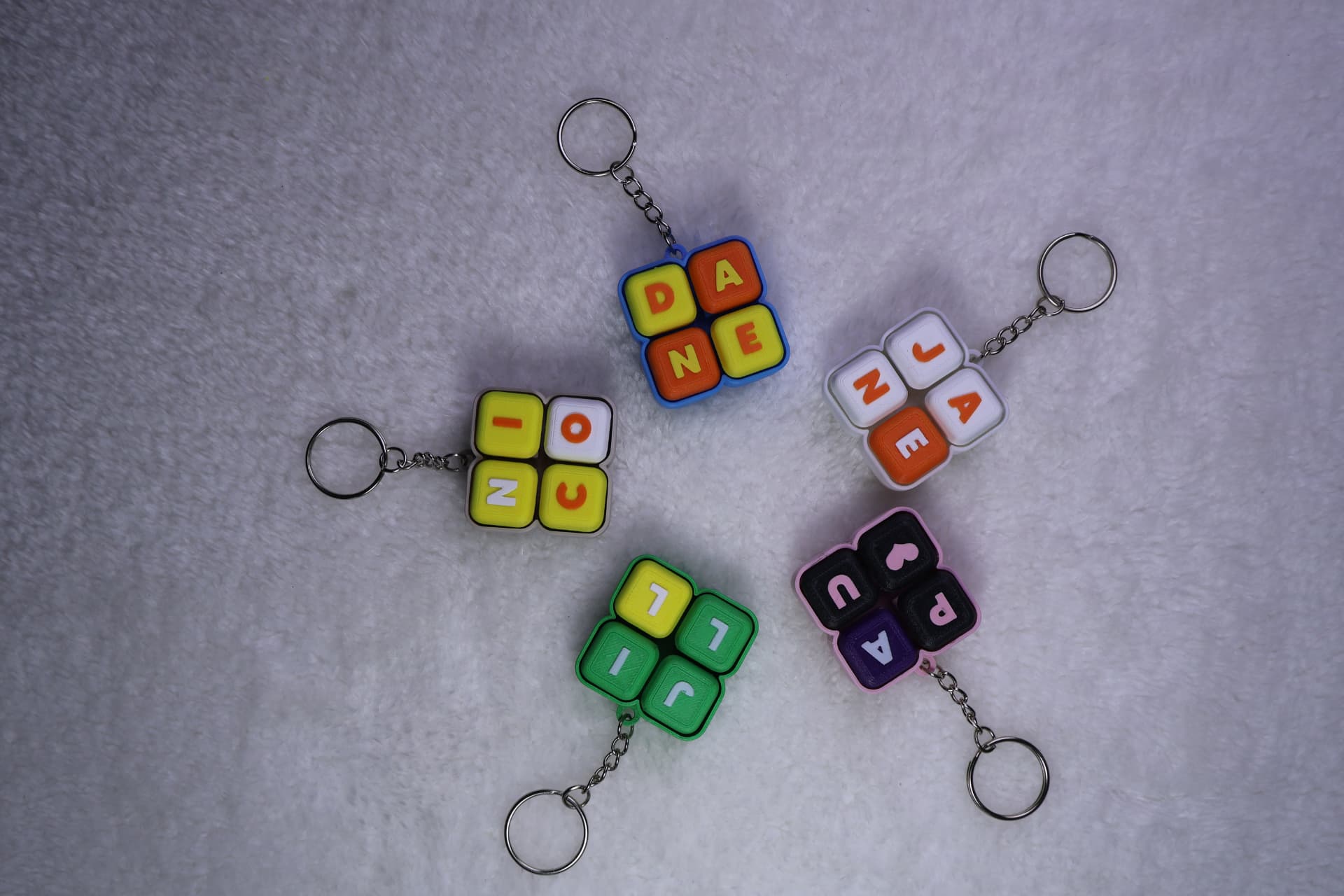 Personalized four-button name clicker keychains